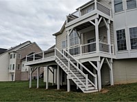 <b>Trex Select Saddle Decking with White Washington Railing and Black Aluminum Balusters-Fascia and Support Posts and Beams are wrapped in White Vinyl in Bowie MD</b>